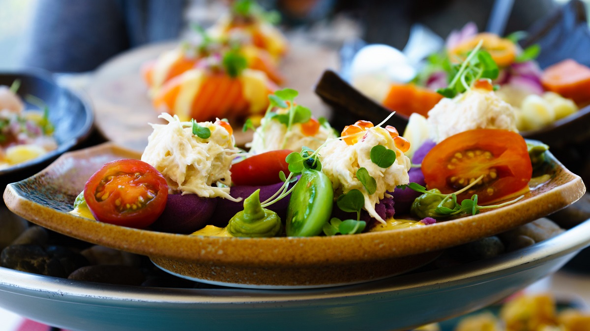 Fancy dish plated beautifuly with veggies at at an outdoor restaurant in San Francisco