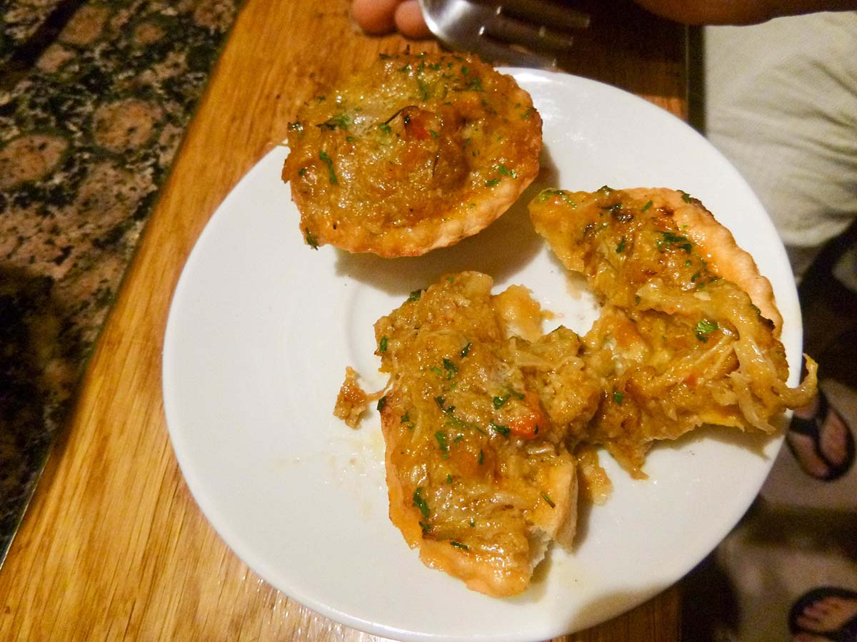 stuffed crab on a white plate.