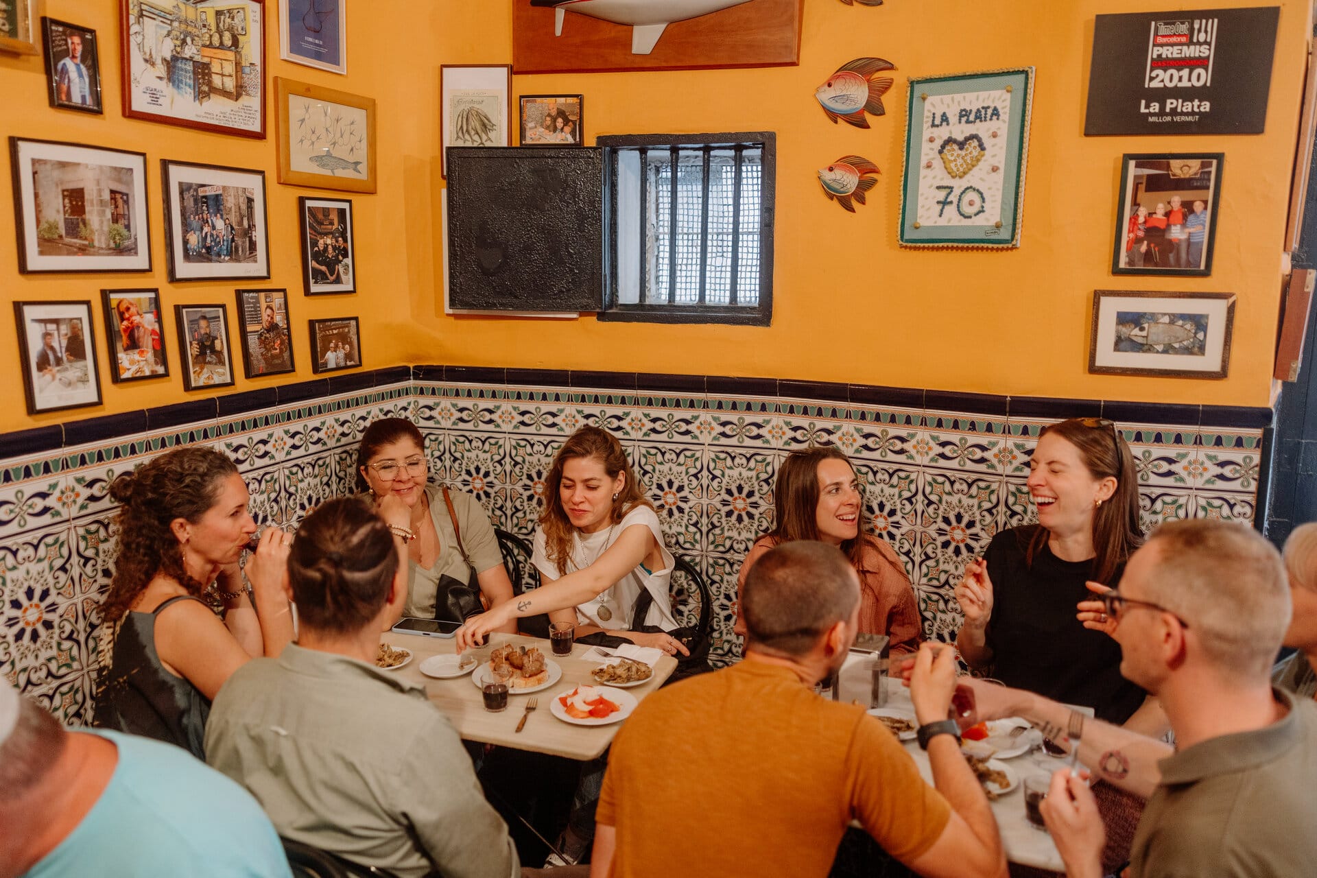 group of people eating tapas in a Barcelona restaurant.