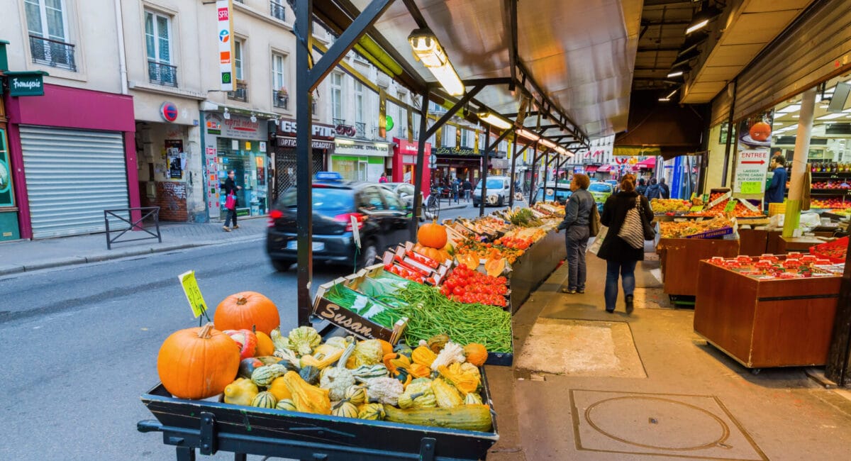 food market in Paris beside a busy street.