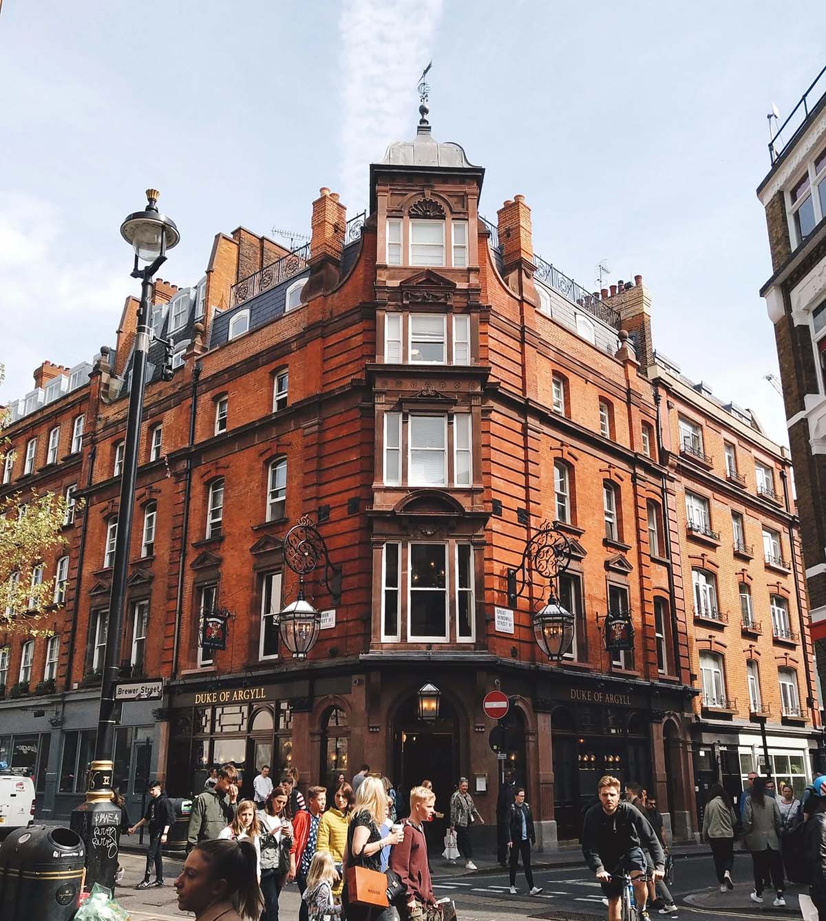 large brick building near a busy London street.
