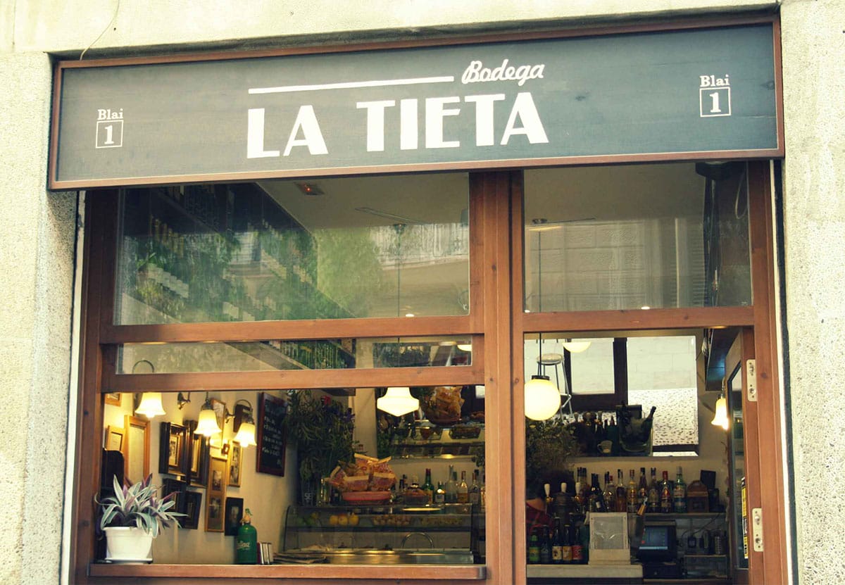 small shopfront with windows and a sign that reads "Bodega La Tieta".