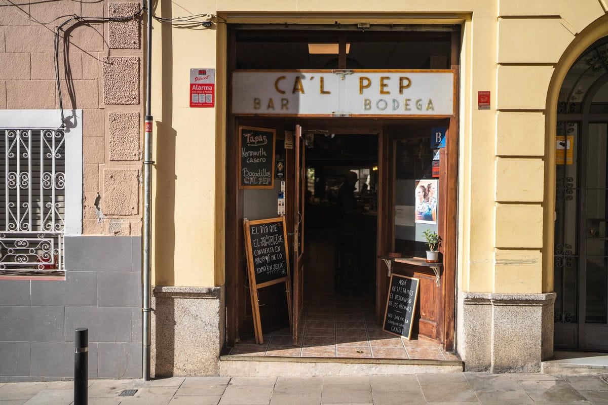 small shopfront with a sign reading "Ca'l Pep Bar Bodega" in Barcelona.