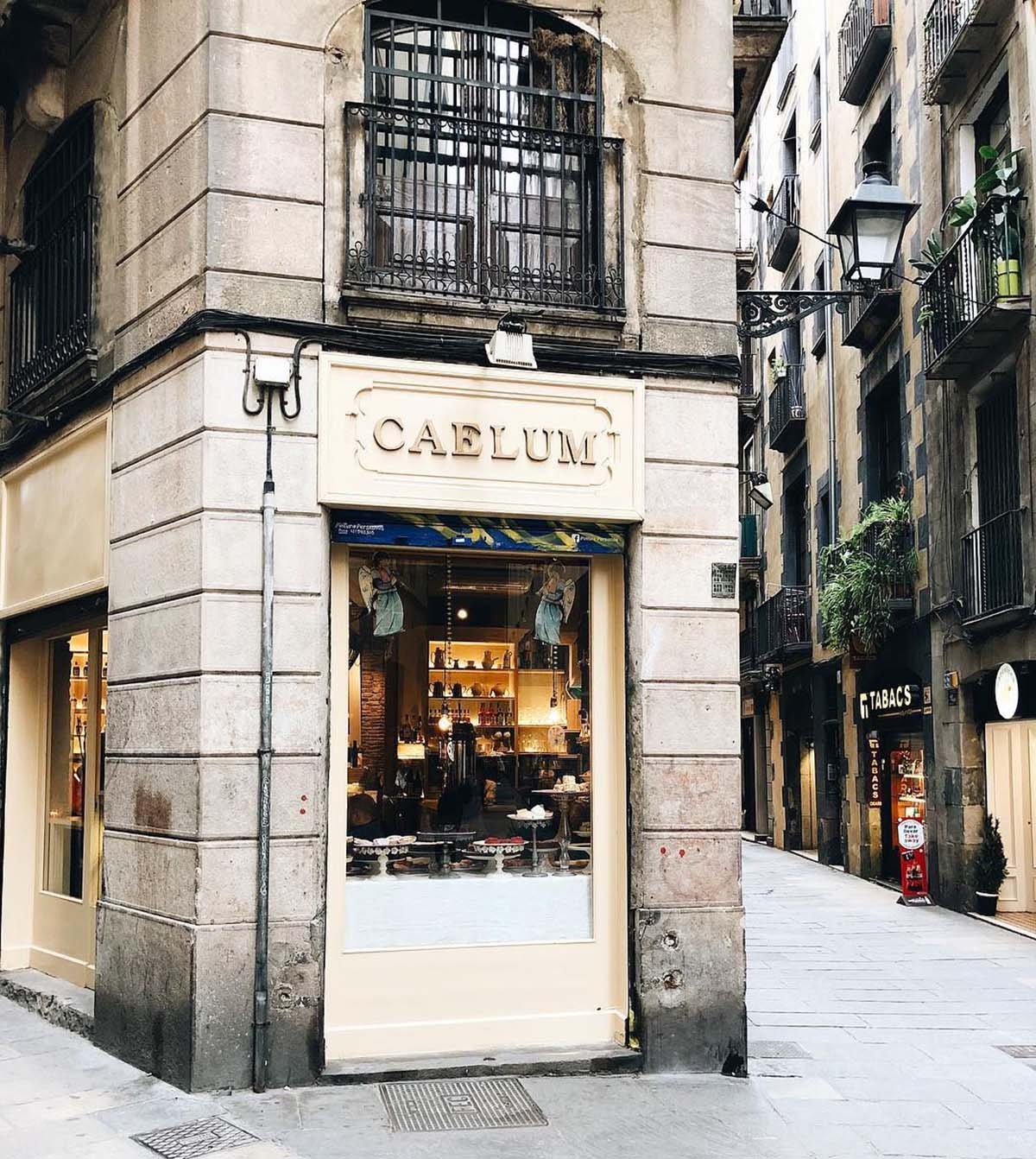 entrance to a hot chocolate shop called Caelum in a stone building.