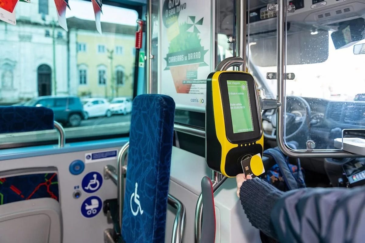 person scanning a card to pay for a bus ride in Lisbon.
