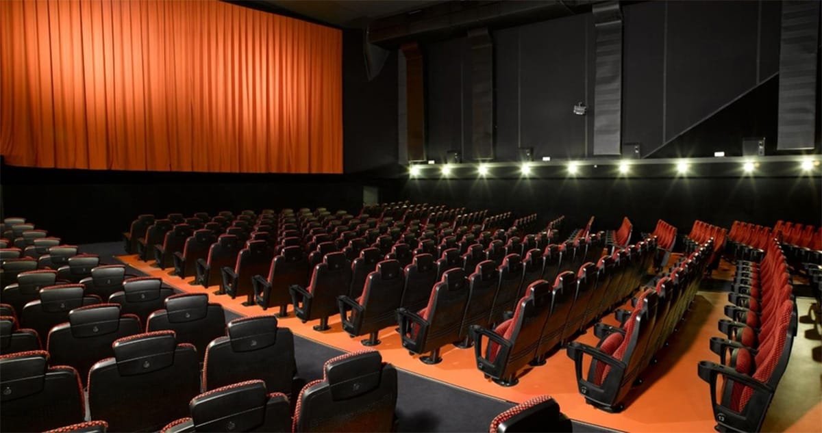 theater seats with a movie screen.