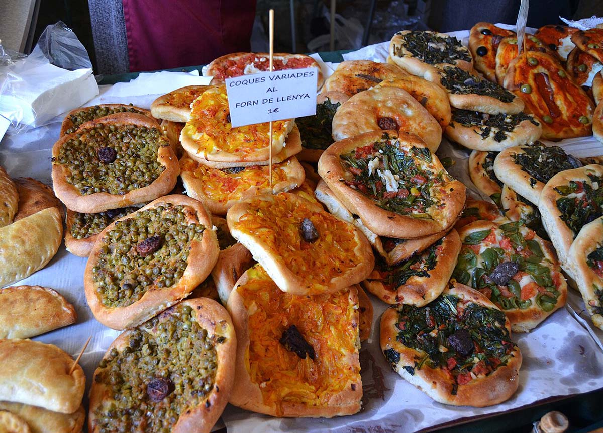 small, pizza-shaped flatbreads with toppings on a table.