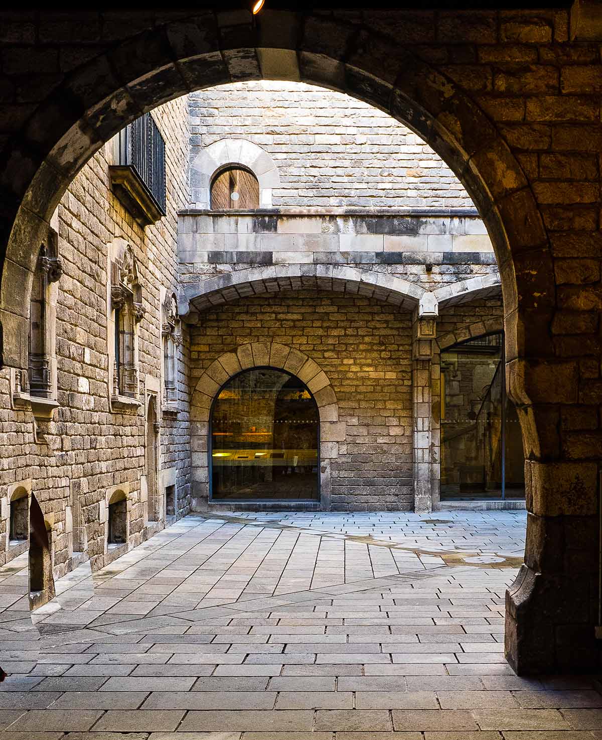 stone archway leading into a stone courtyard.