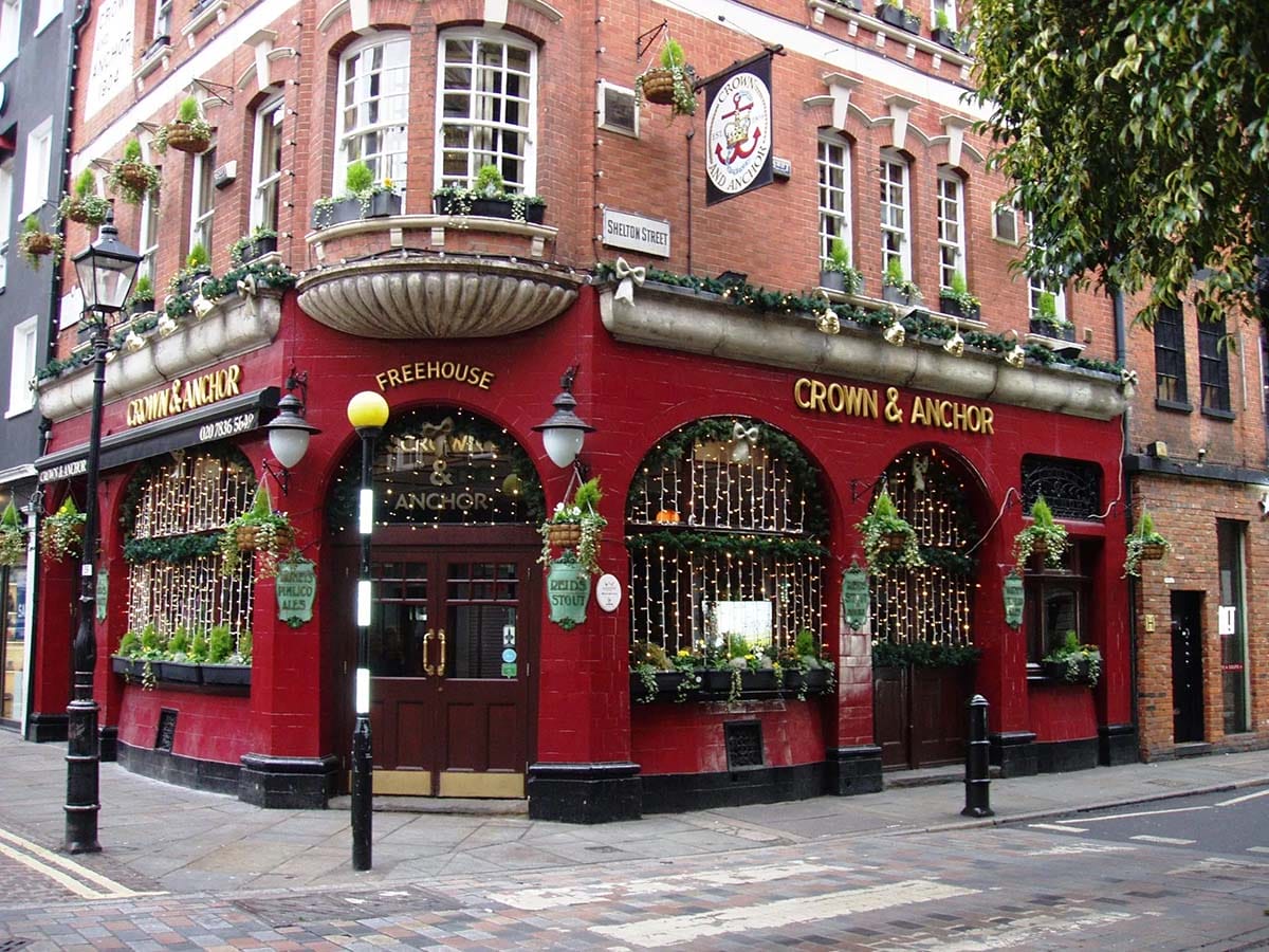 red brick restaurant on a corner with arched windows.