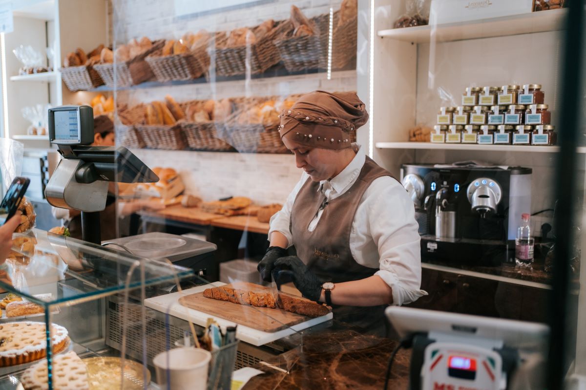 A woman working at a bakery in Florence, Italy. 