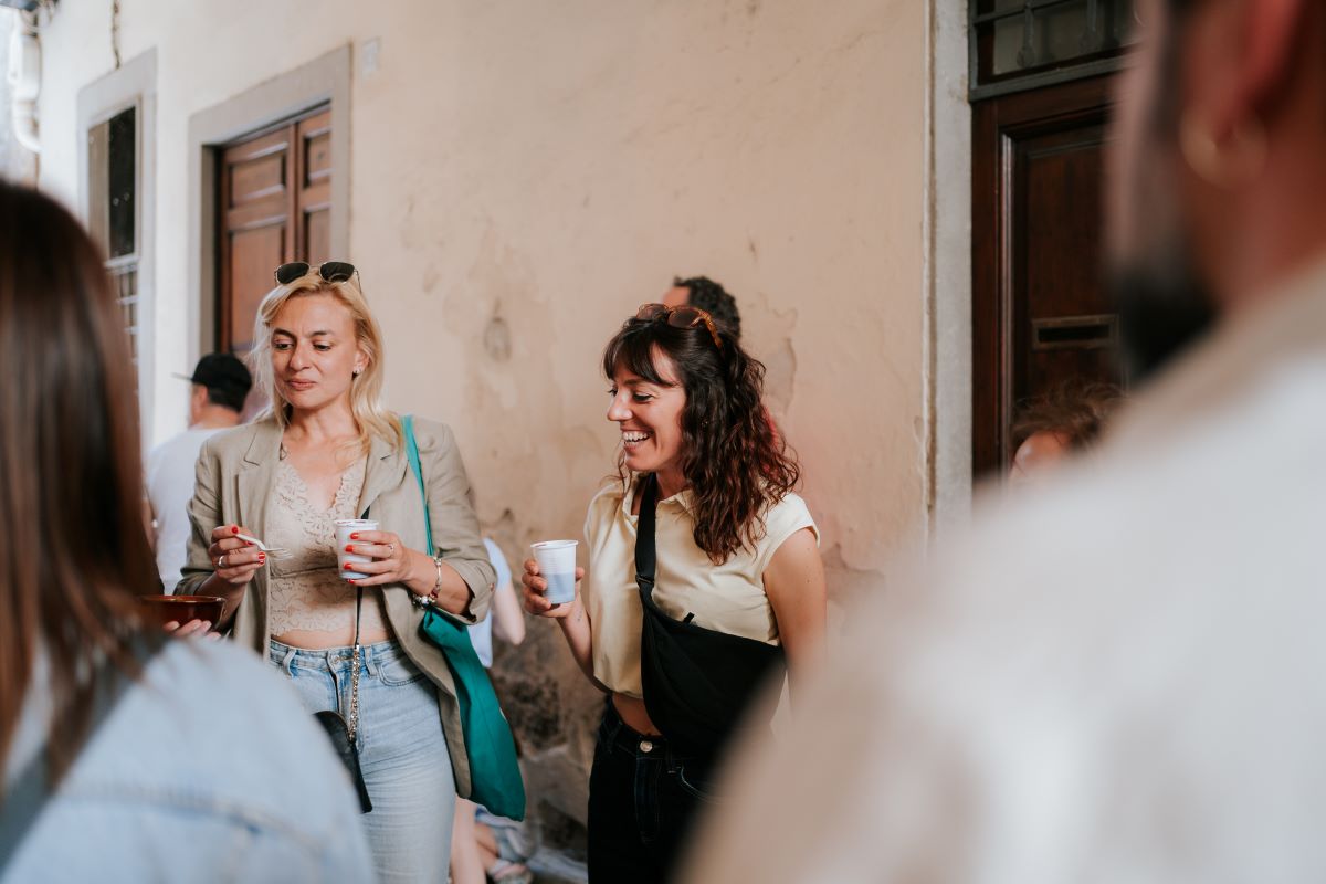 People standing outside waiting to enter one of the secret bakeries in Florence, Italy. 