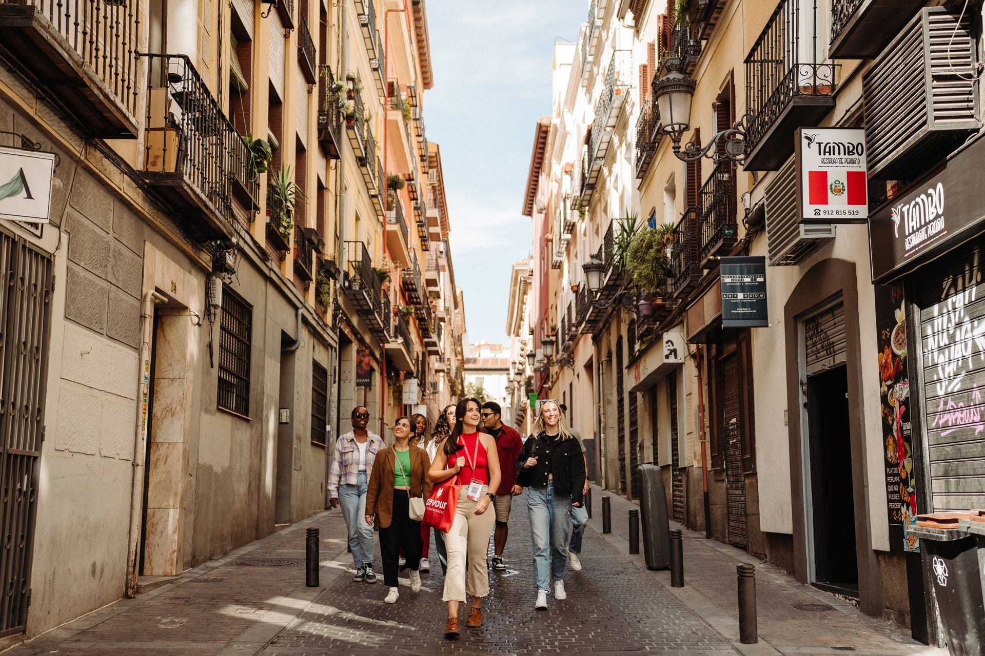 tour guide leading a group through the beautiful streets of Madrid.