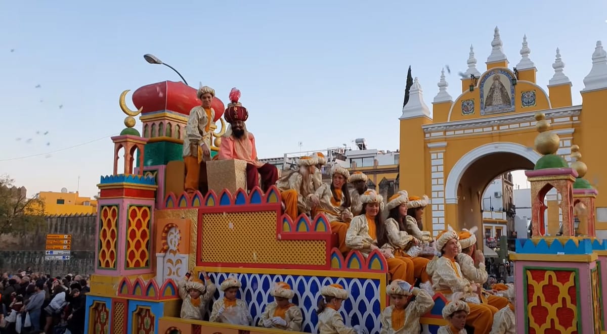 large parade float with one of three kings.