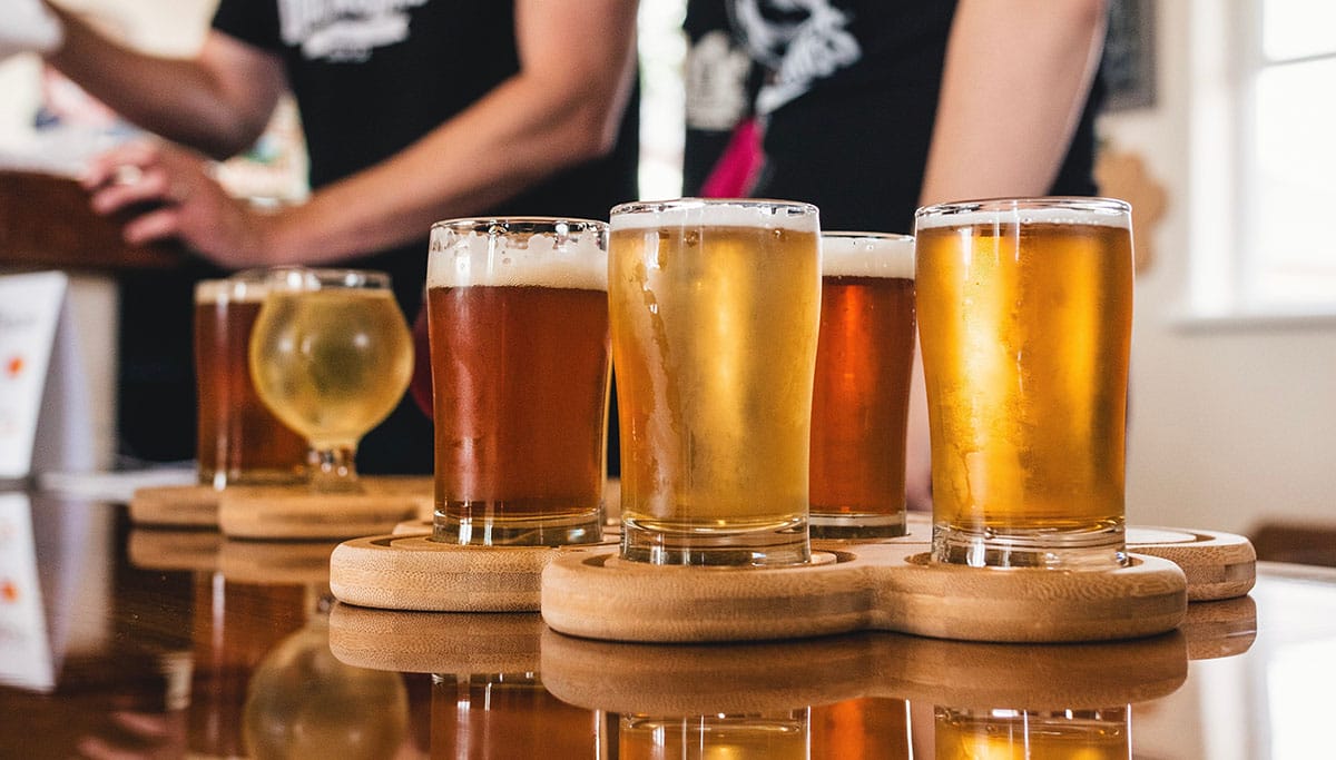 flight of beers on a table.