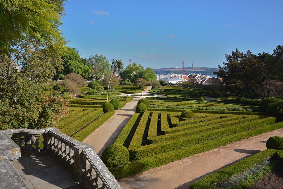 hedges trimmed intro triangular shapes surrounded by trees near Lisbon.