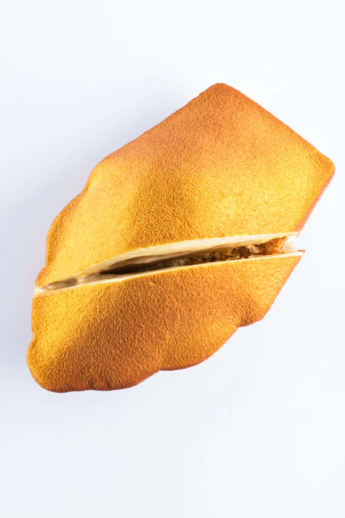 elegant madeleine cut in half diagonally.