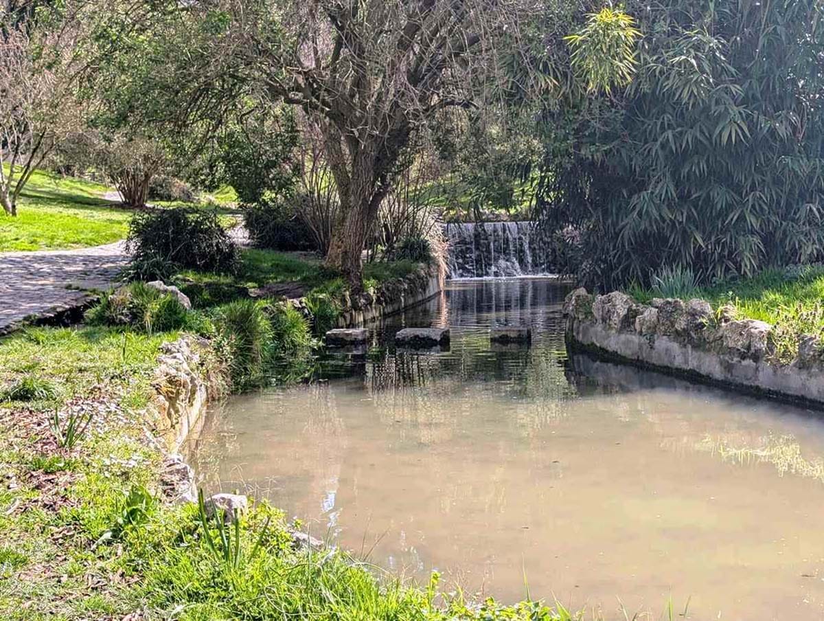 river flowing beside a footpath.