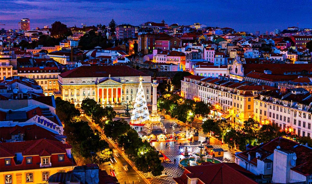 city square in Lisbon with a large Christmas tree in the center.