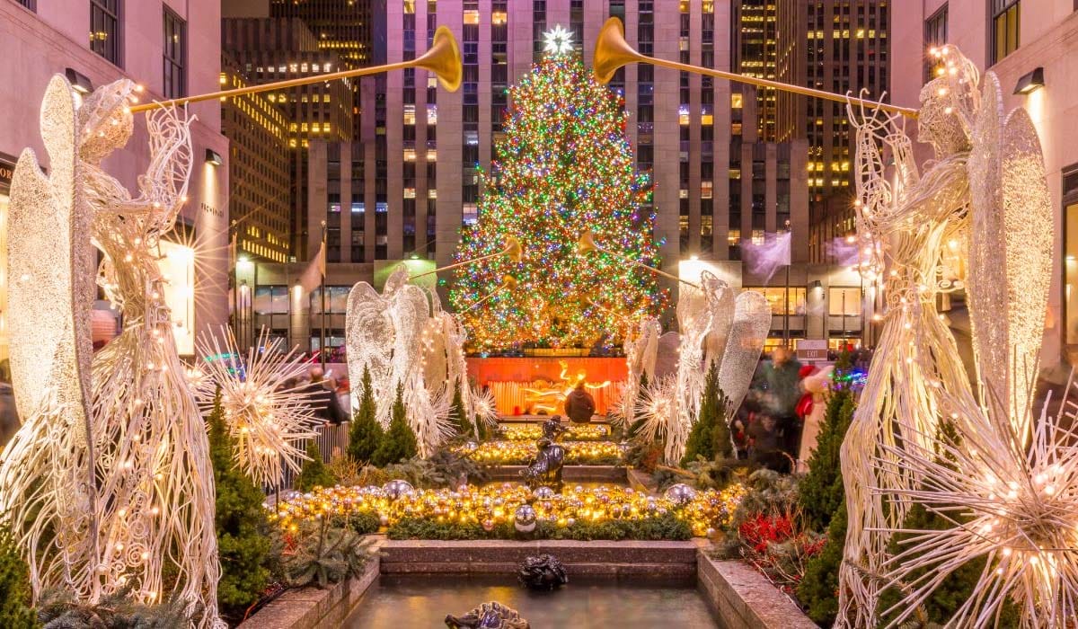 large illuminated Christmas tree with wire angels.