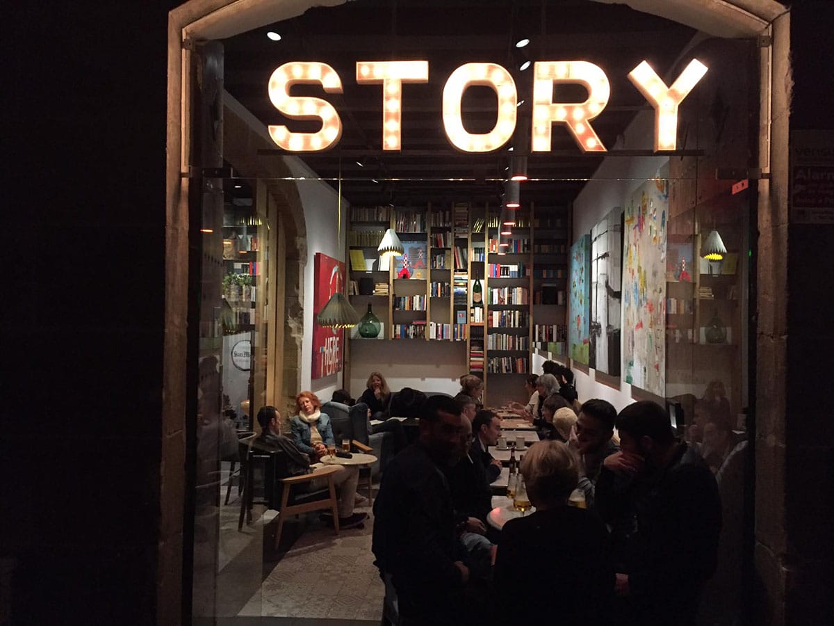 people sitting at tables in the Story bar in Barcelona.