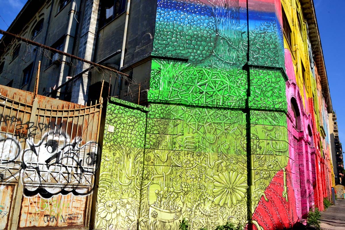 colorful painted building on a street corner in Rome.