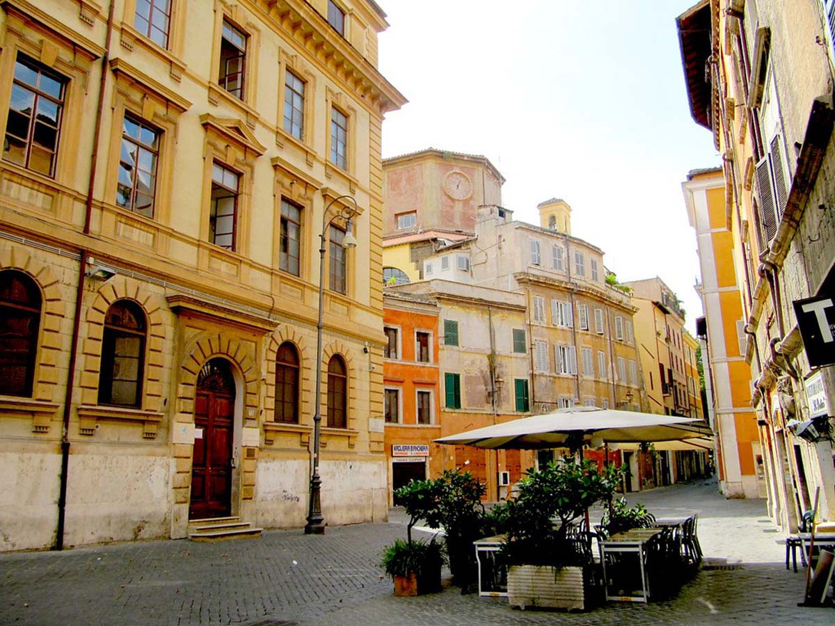 large stone buildings lining a stone-paved street.