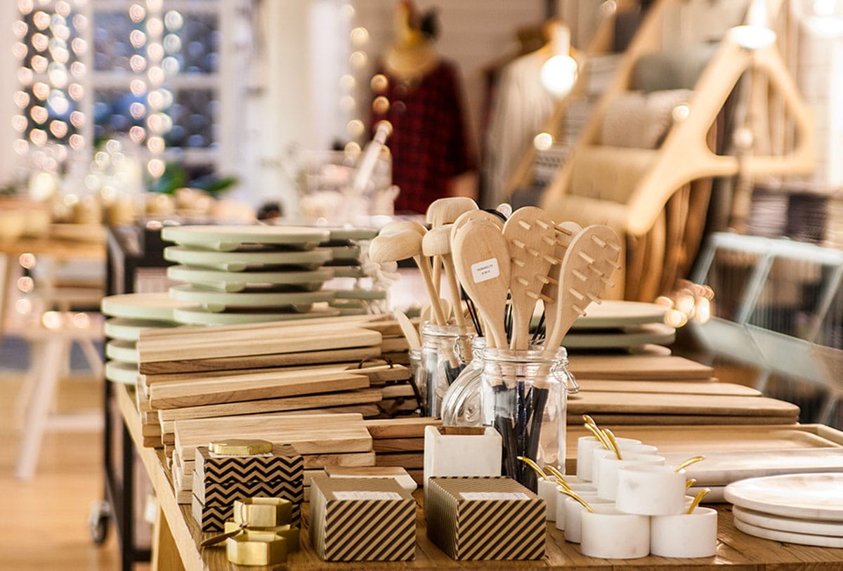 wooden home goods like candles and serving platters in a store.