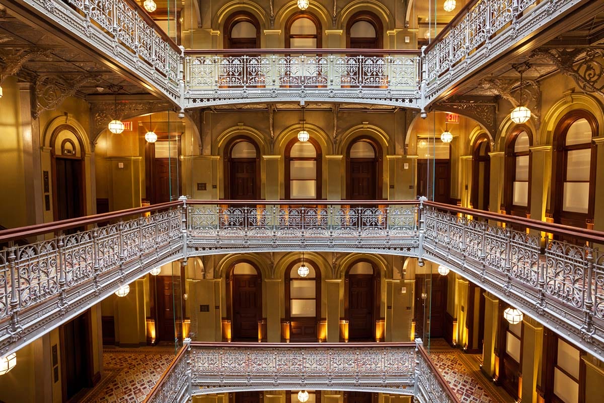 multi-story hotel with a balcony on each level.
