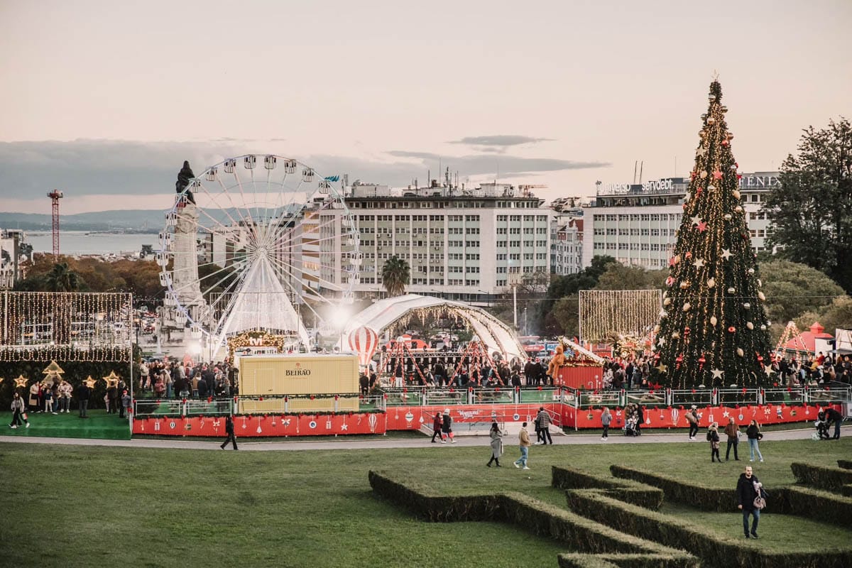 ferris wheel, Christmas tree, and market booths.