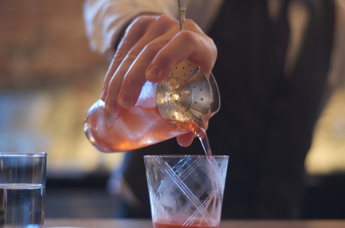 A bartender pouring a Venetian cocktails.